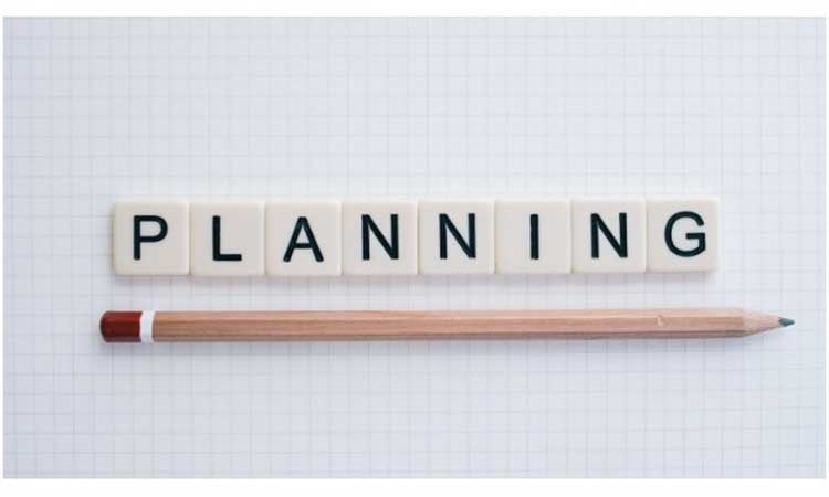 Letter tiles spelling "Planning" underlined by a pencil